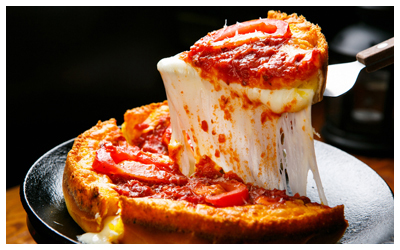 Deep dish pizza being served