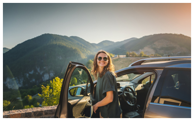 Image of a woman exiting a rental car.