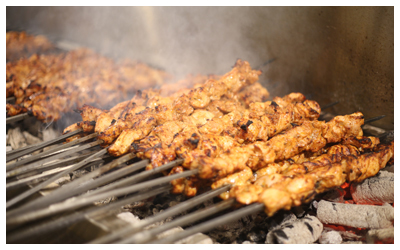 Meat kababs on a charcoal barbeque