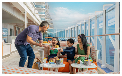 Family enjoying lunch on lounge chairs on the Wake View Terrace