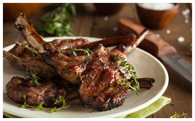 Lamb chops plated with herbs and spices