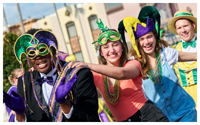 Costumed musicians and guests dancing in a conga line